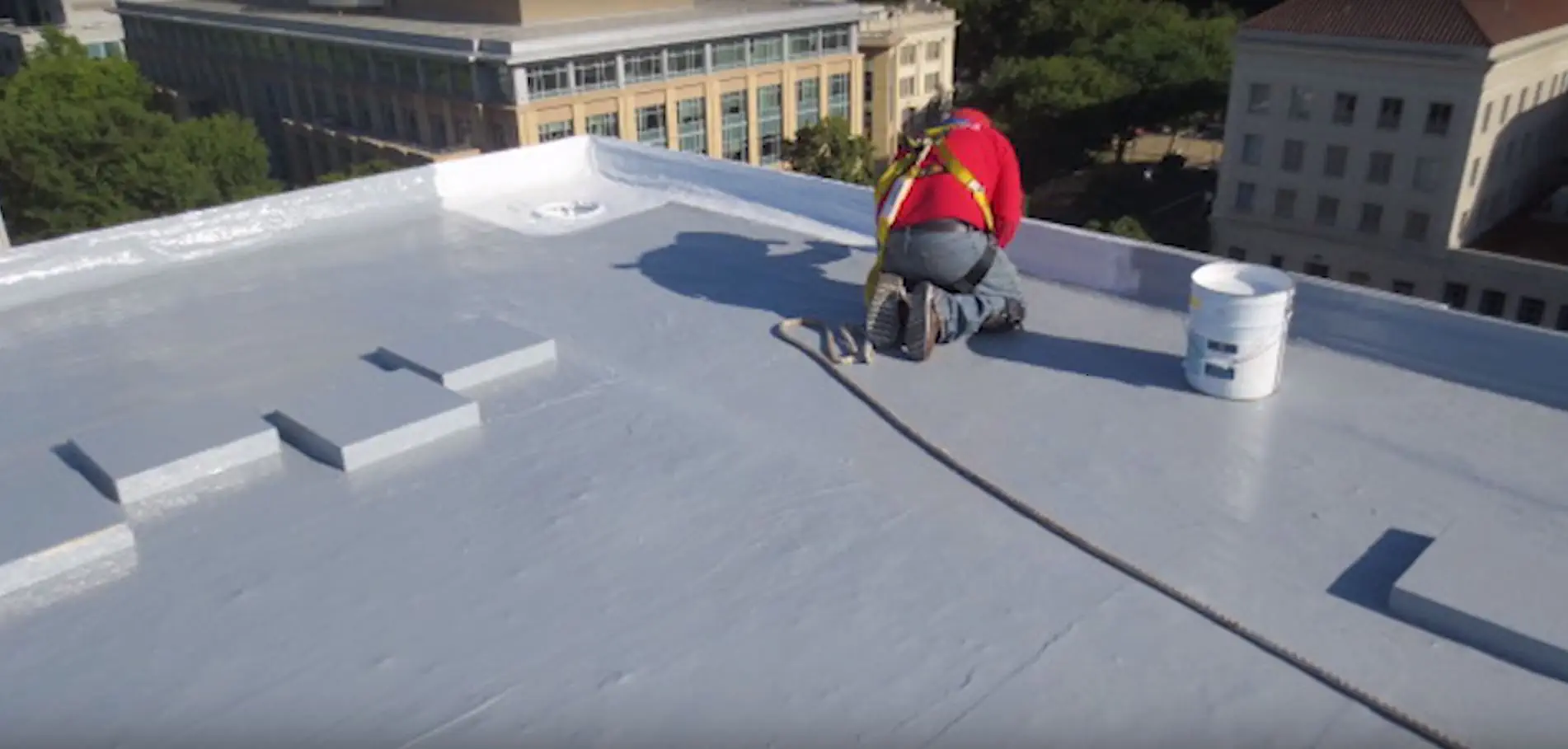 Crew working on a TPO flat roof in the Puget Sound region