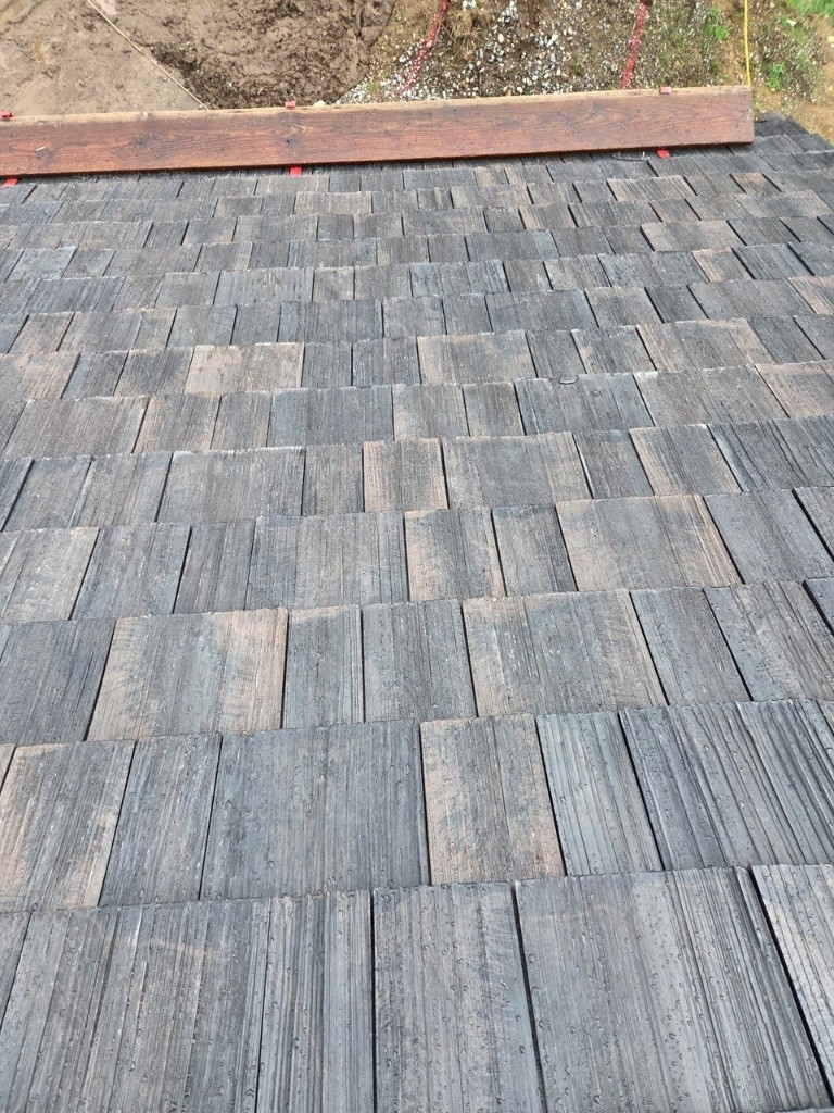 Brava shake composite tile roof above a modern patio in Greater Seattle