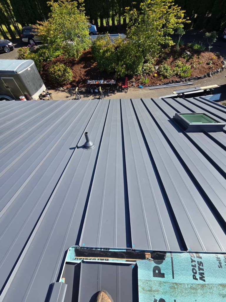 Ridge perspective on a newly installed standing seam metal roof