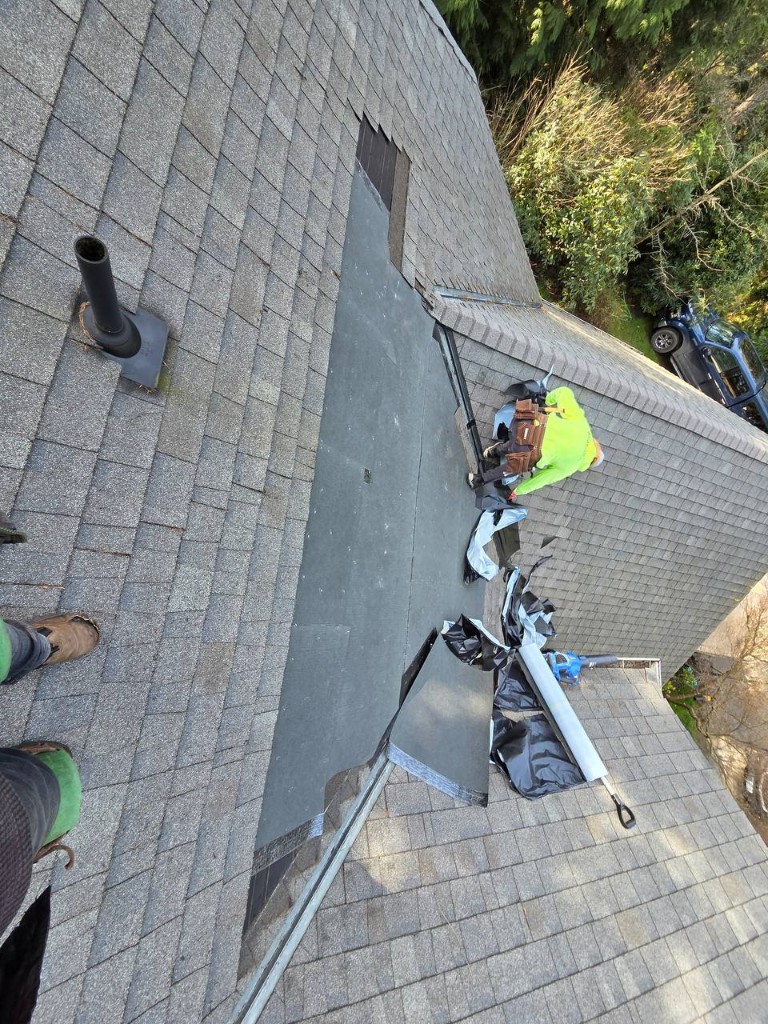 Roof tear-off near a valley and plumbing stack