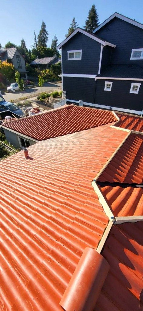 Terracotta Brava Spanish barrel tile ridge overlooking a Puget Sound neighborhood