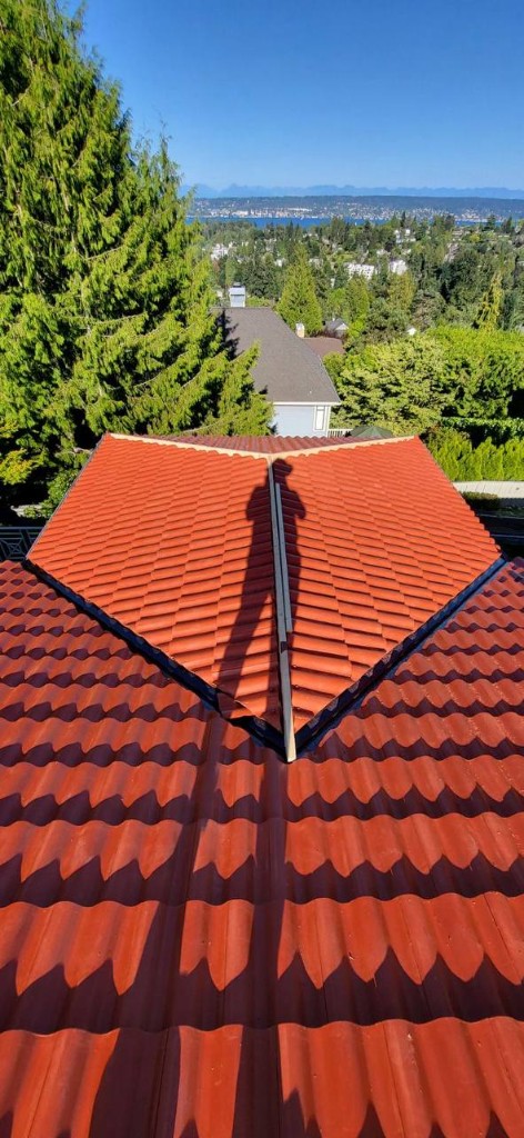 Spanish Brava curved barrel tiles on a residential roof with lake view