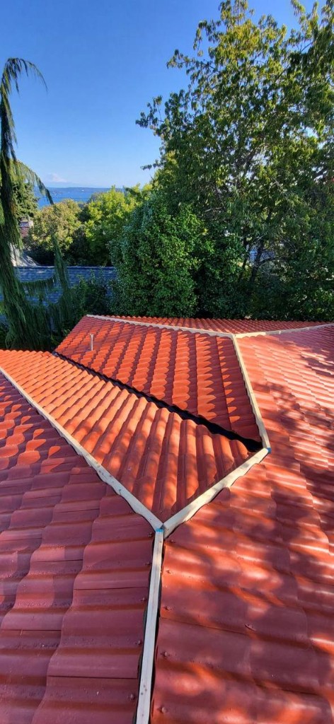 Brava Spanish S-Tile field tiles during active roof installation