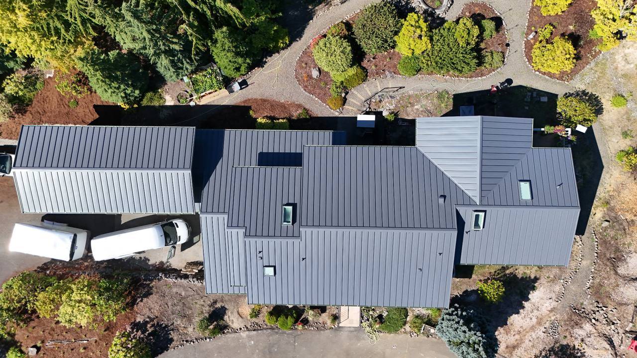 Standing seam metal roof panels with clean vertical seams on a Bothell home in Bothell