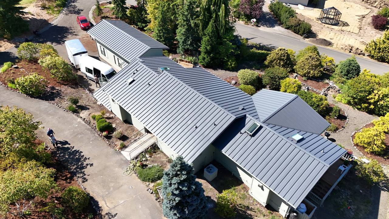 Metal roof installation showing underlayment and clip layout in Bothell