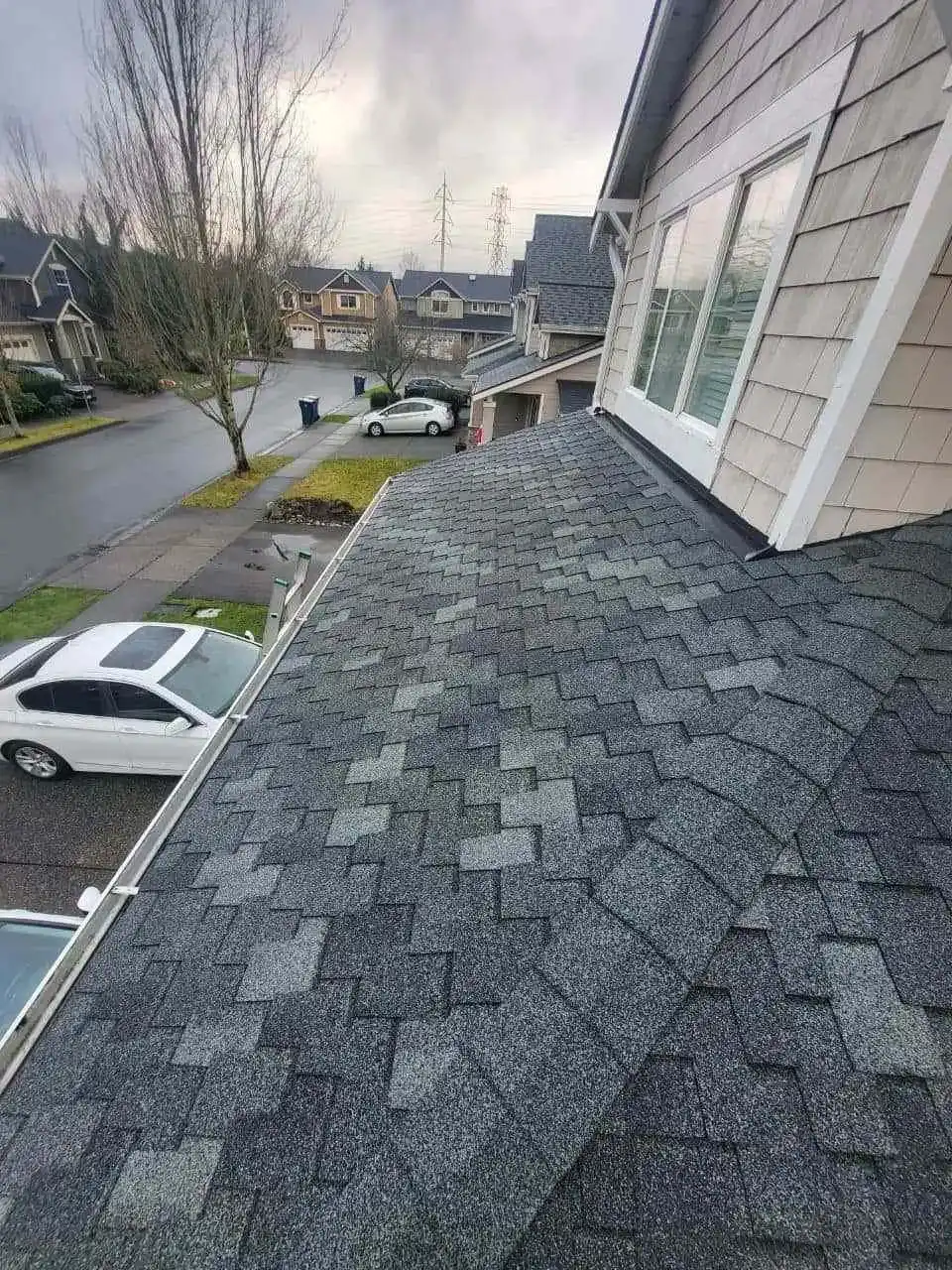 Crew completing shingle and flashing work