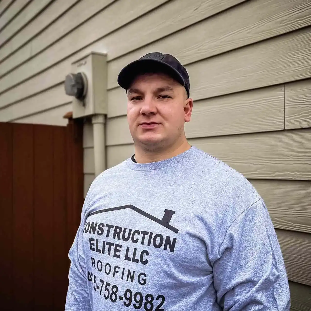 Construction Elite LLC leadership on a roofing project
