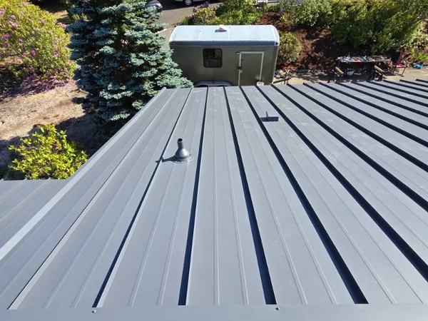 Standing seam reroof with skylight and vent penetrations