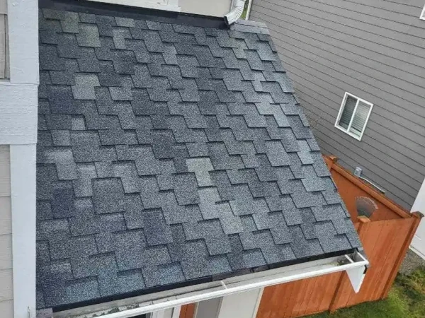 Residential roofing crew on a tear-off