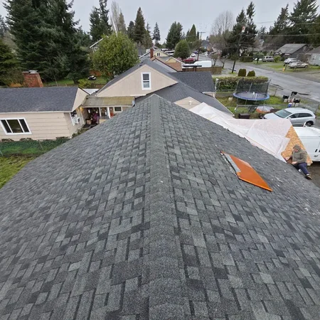Licensed roofers checking flashing and valleys