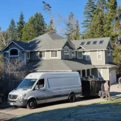 Licensed roofers on a residential roof project