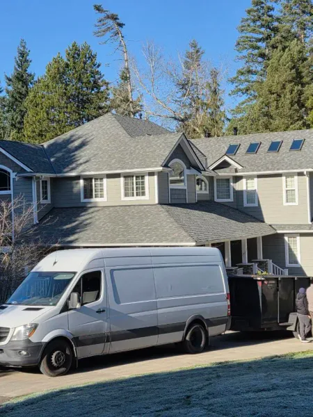 Licensed roofers completing ridge cap work