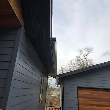 Gutter repair and downspout work on a Puget Sound home