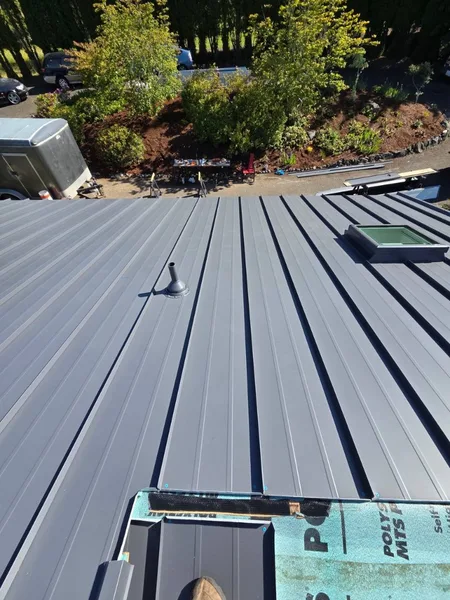 Ridge perspective on a newly installed standing seam metal roof