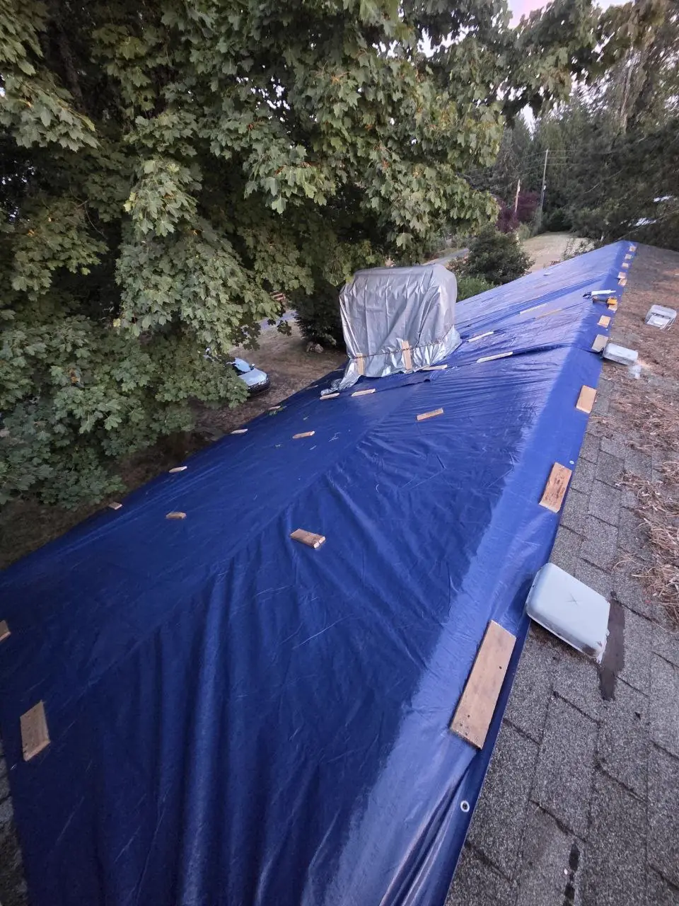 Ridge blue tarp with chimney wrapped in silver cover