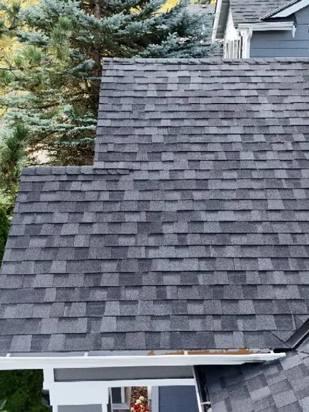 Finished dormer shingle detail after residential roof repair