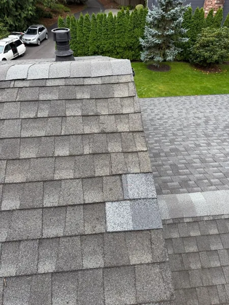 Completed localized shingle patch after roof leak repair