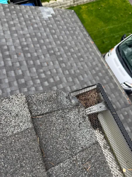 Gutter edge debris inspection during roof leak tracing