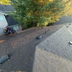 Finished gray architectural shingle slope after roof replacement