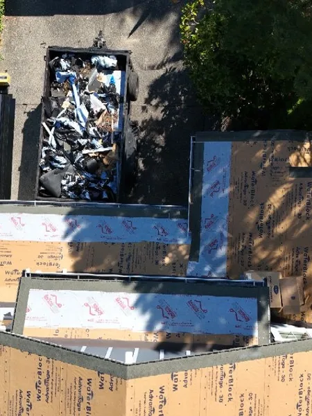 Starter course of new architectural shingles at the eave line