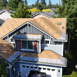New underlayment and shingle field during shingle roof replacement