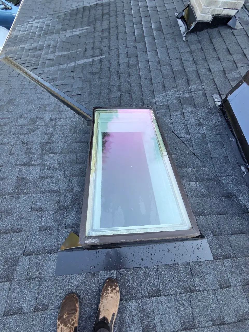 Skylight flashing detail wet shingle roof in Bellevue