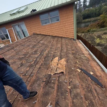 Soft roof deck exposed on a residential tear-off