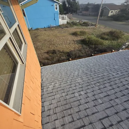 Architectural shingles finished along a wall