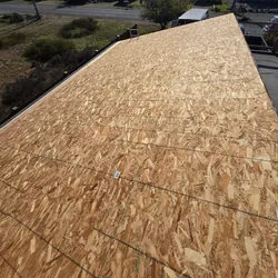 New OSB sheathing on a residential roof slope